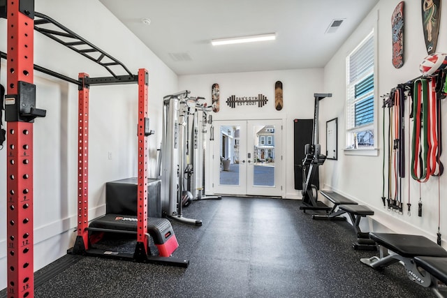 workout room featuring french doors