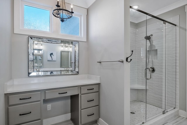 bathroom featuring vanity and a shower with shower door