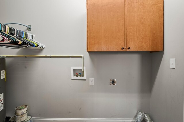 laundry area with cabinets, hookup for a washing machine, and hookup for an electric dryer