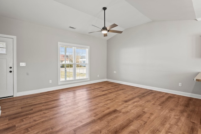 unfurnished living room with wood-type flooring, lofted ceiling, and ceiling fan