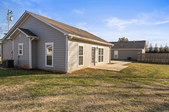 back of house featuring a yard, a patio area, and central air condition unit