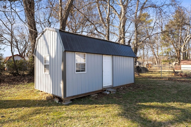 view of outbuilding featuring a yard