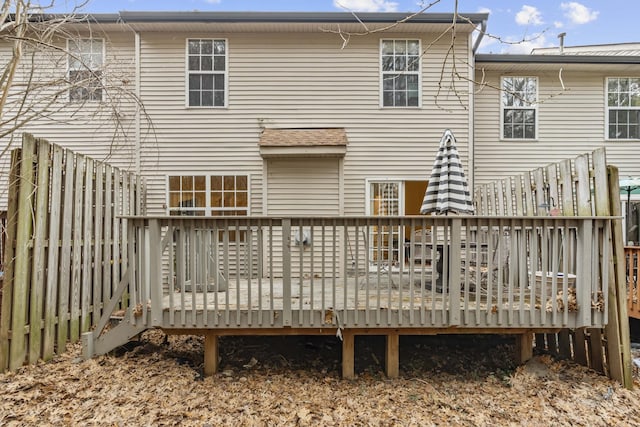 rear view of property with a wooden deck