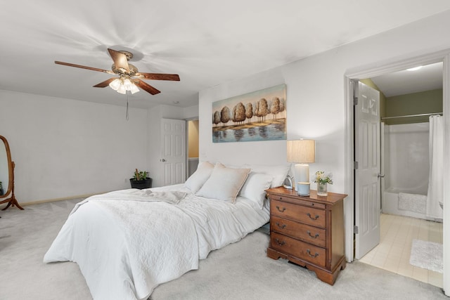 bedroom featuring ceiling fan and light carpet