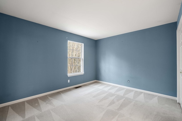 empty room with light colored carpet