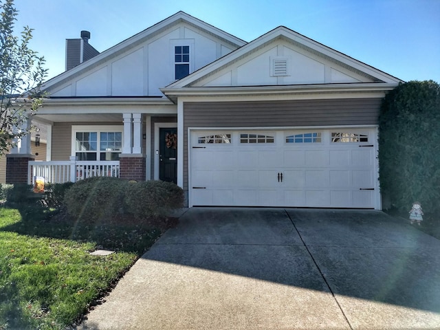 view of front of home with a garage and covered porch