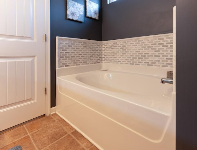 bathroom featuring tile patterned flooring and a bathing tub