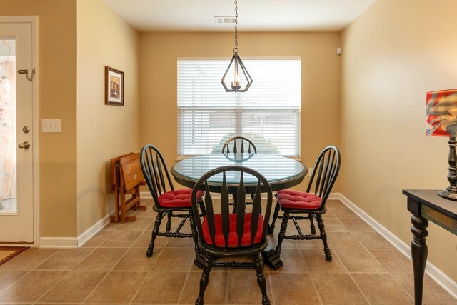 dining area with tile patterned flooring