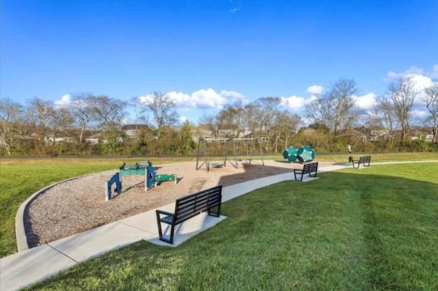 surrounding community with a lawn and a playground