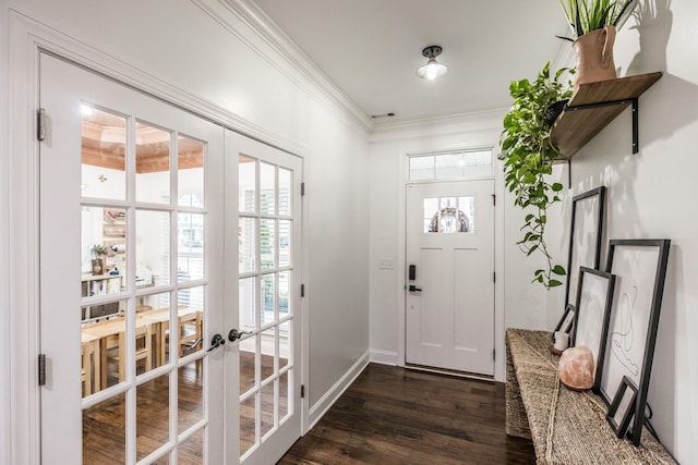 entrance foyer featuring dark hardwood / wood-style flooring, crown molding, a wealth of natural light, and french doors