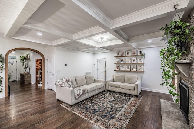 living room featuring beamed ceiling, crown molding, coffered ceiling, and dark hardwood / wood-style flooring