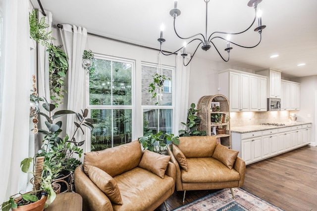 interior space with an inviting chandelier and wood-type flooring