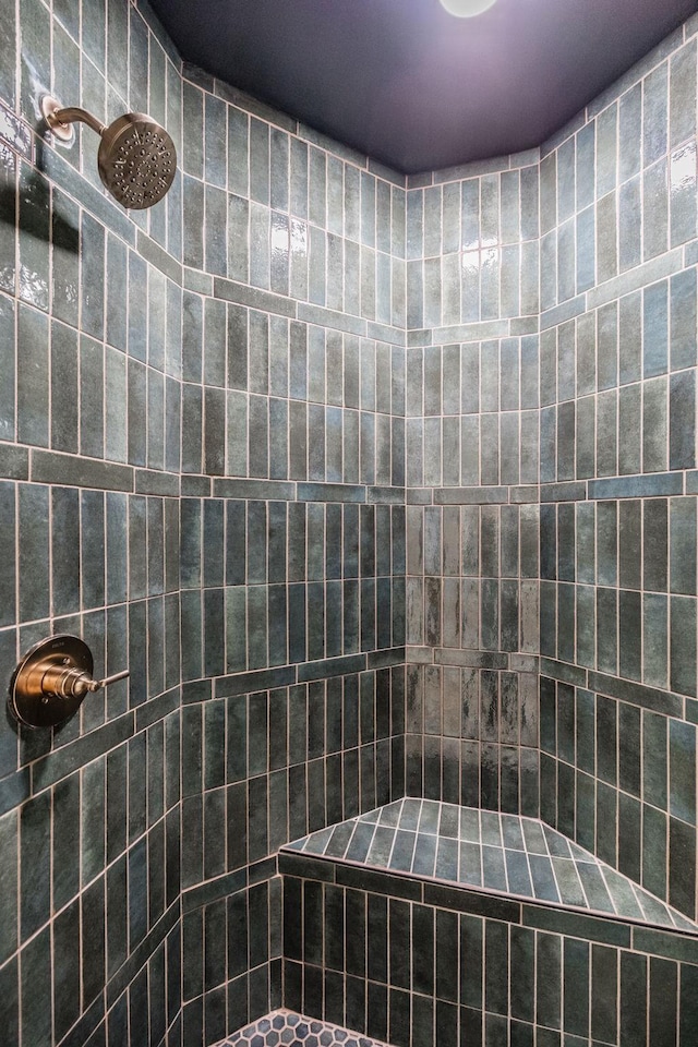 bathroom with a tile shower