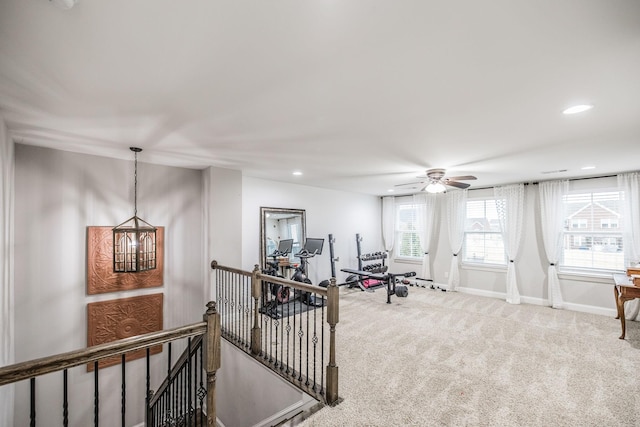 workout area featuring carpet floors and ceiling fan