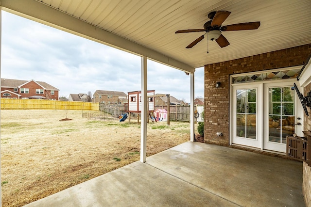 view of patio / terrace featuring a playground and ceiling fan