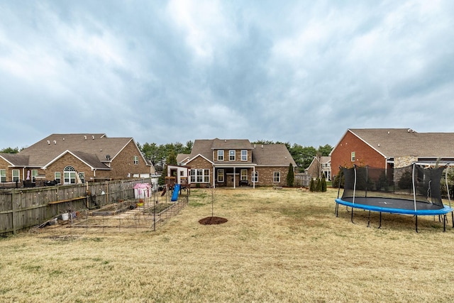 view of yard featuring a trampoline