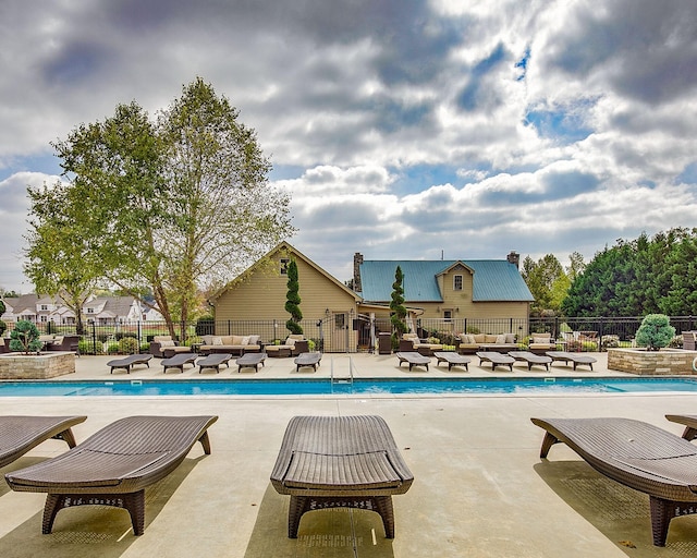 view of pool featuring a patio