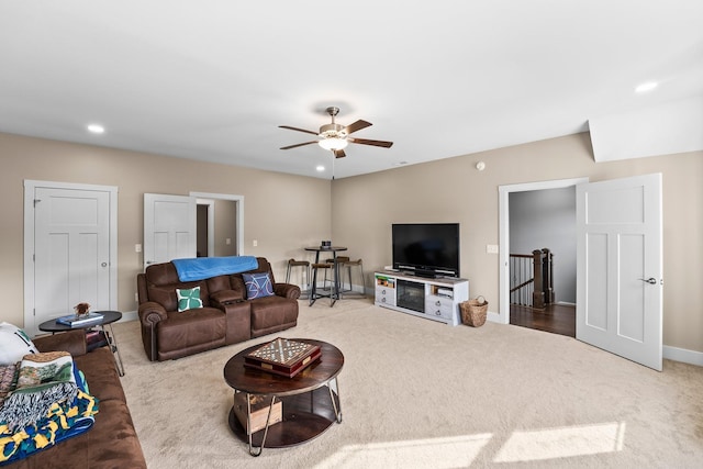 living room featuring ceiling fan and carpet flooring