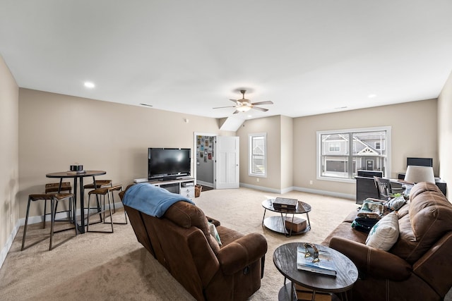 living room with light colored carpet and ceiling fan