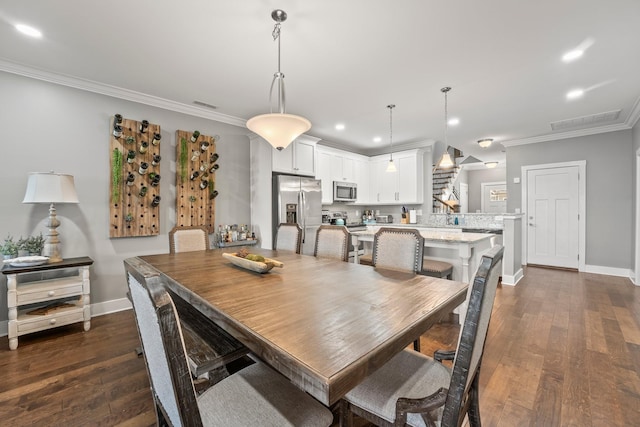 dining room with ornamental molding and dark wood-type flooring