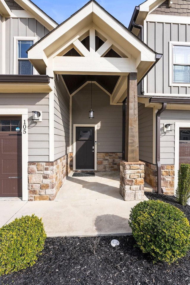 view of exterior entry with a garage