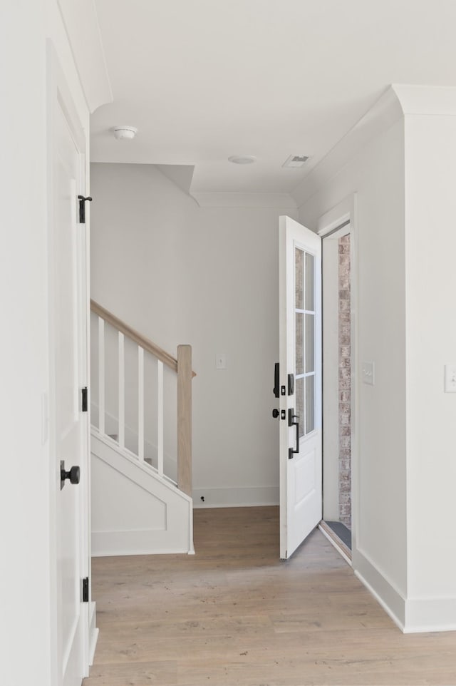 foyer entrance with light wood-type flooring