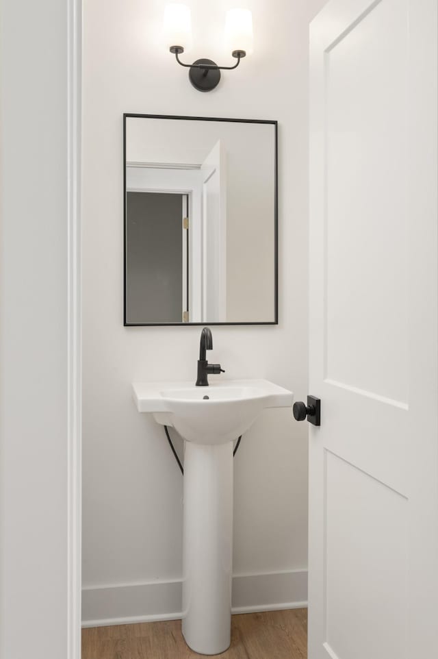 bathroom with wood-type flooring