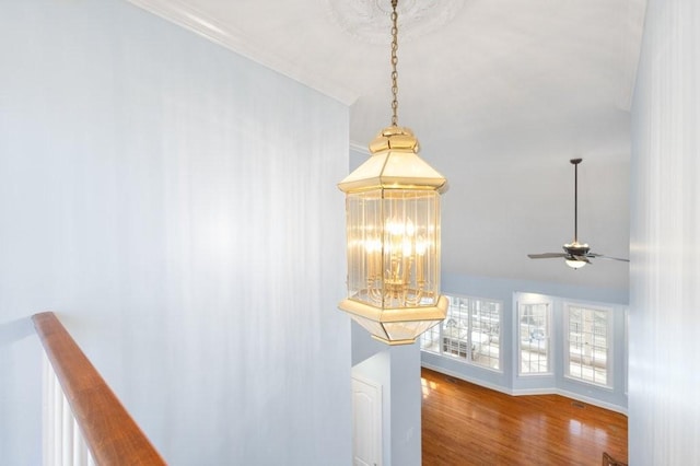 interior details featuring wood-type flooring and ceiling fan