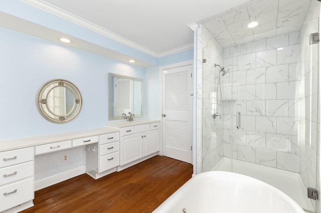 bathroom featuring ornamental molding, shower with separate bathtub, hardwood / wood-style floors, and vanity