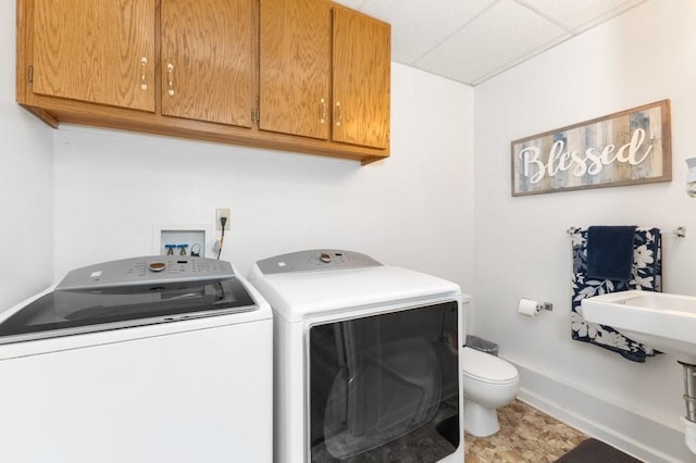 laundry area with independent washer and dryer