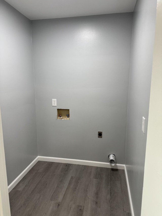 clothes washing area with hookup for a washing machine, electric dryer hookup, and dark hardwood / wood-style floors