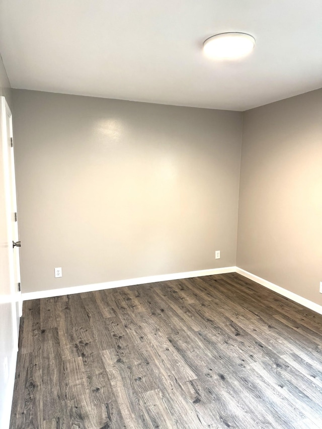 unfurnished room featuring dark hardwood / wood-style floors