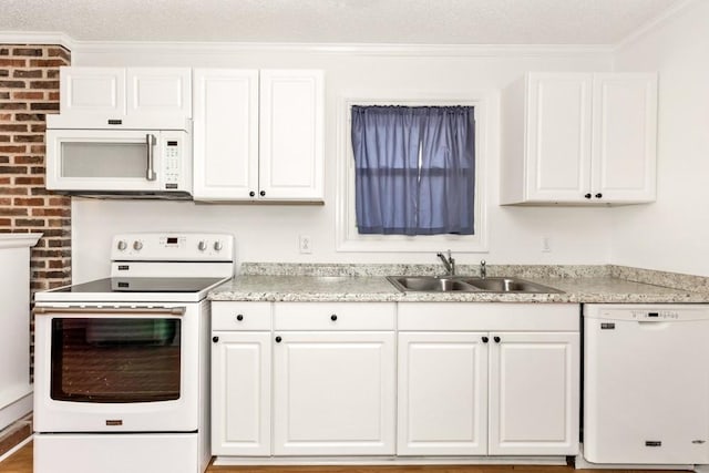 kitchen with white cabinetry, sink, ornamental molding, white appliances, and a textured ceiling