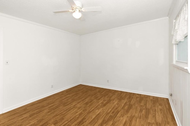 unfurnished room with ornamental molding, hardwood / wood-style floors, and ceiling fan