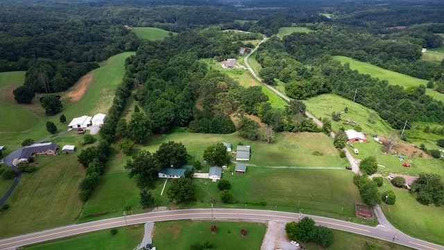 birds eye view of property with a rural view