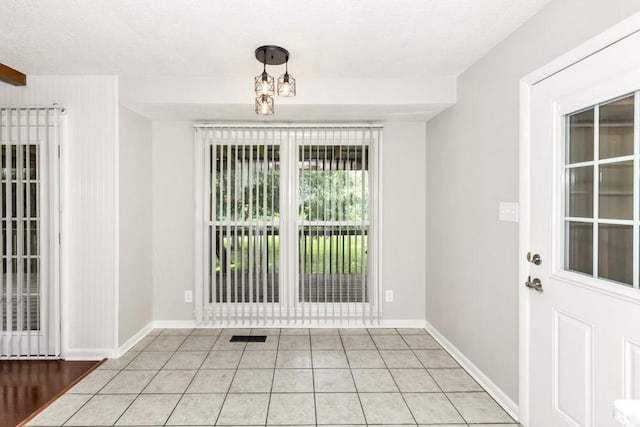 interior space with light tile patterned floors