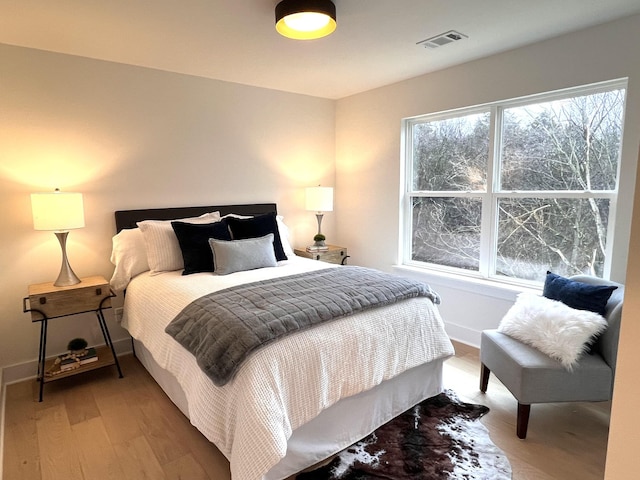 bedroom with hardwood / wood-style floors