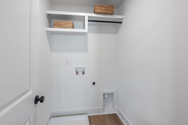 washroom with hardwood / wood-style flooring, washer hookup, and hookup for an electric dryer