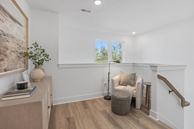 sitting room with light hardwood / wood-style floors