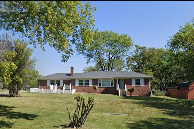 ranch-style house with a front lawn