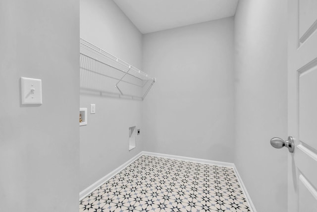 laundry room with hookup for a washing machine, baseboards, laundry area, electric dryer hookup, and tile patterned floors