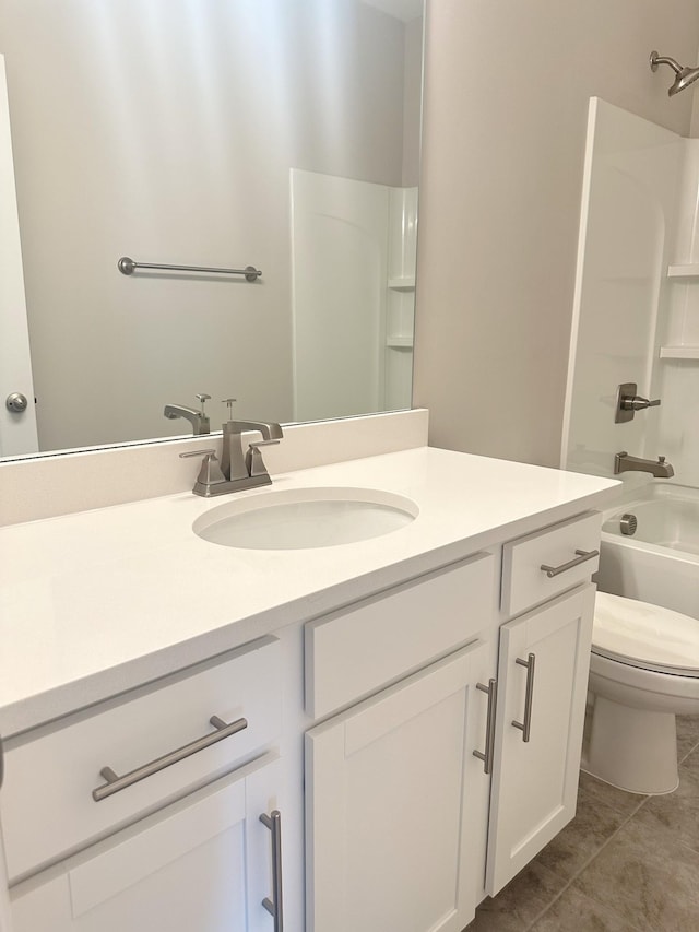 bathroom featuring vanity,  shower combination, toilet, and tile patterned floors