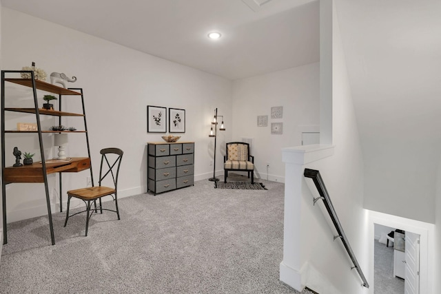 living area with an upstairs landing, recessed lighting, baseboards, and carpet