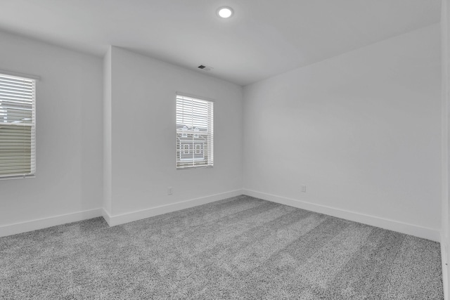 spare room featuring carpet flooring