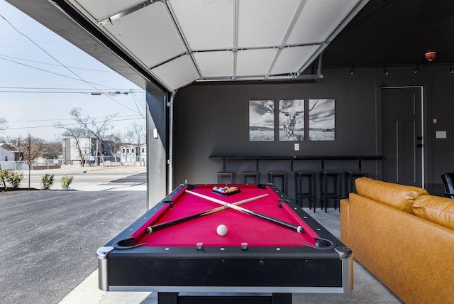 rec room with pool table and concrete floors