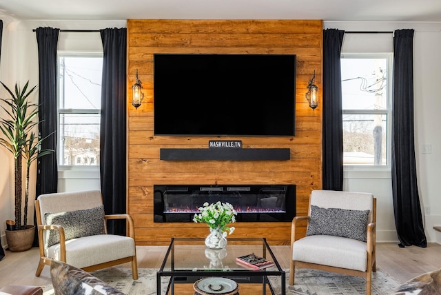 living room featuring wood-type flooring and a wealth of natural light