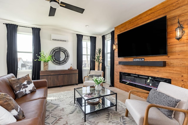 living room featuring ceiling fan and a wall mounted AC