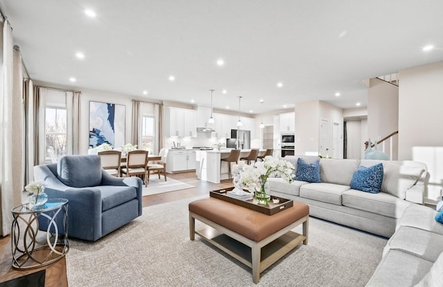 living room with radiator and light hardwood / wood-style flooring