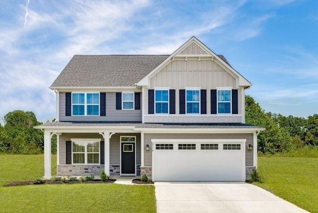 craftsman-style home featuring a garage and a front yard