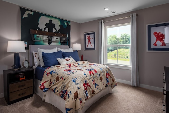 bedroom with light colored carpet